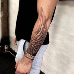 a person with a tattoo on their arm