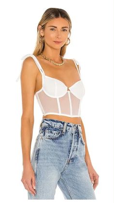 Elevate your style with the Kat the Label Femme Bustier in White. Perfect for creating stunning white bustier top outfits for a night out or pairing with jeans for a casual yet chic look. Whether you're wondering how to style a white bustier top or looking for inspiration for a white denim bustier outfit, this versatile piece is a must-have. Ideal for layering or wearing as a statement on its own. Shop now at Famous Designer Brands 4 Less!

White Denim Bustier Outfit, White Fox Sharp Edges Bustier, How to Style White Bustier, White Bustier Jeans, White Bustier Top Outfits Night, White Bustier Zara, White Corset Bustier Outfit, Bustier White Dress Outfit, How to Style a White Bustier Top, 2024 fall fashion trends White Bustier, Bustier Dress, Feminine Design, Bustier Top, Fabric Trim, Lingerie Collection, The Label, 30 Day, Favorite Outfit