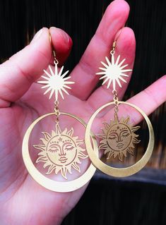 "Long, fashion, celestial, brass, drop/dangle, statement earrings: sun goddess and goddess of shooting stars; \"Novum,\" (aka Alectrona and Asteria). Total drop length: 3.5\" x 1.90.\"" Celestial Brass Jewelry, Symbolic Gold Earrings With Sun And Moon Design, Gold Symbolic Earrings With Sun And Moon Design, Mystical Gold Earrings For Festival, Spiritual Sun And Moon Design Earrings For Festival, Mystical Gold Earrings With Sun And Moon Design, Nickel Free Celestial Earrings, Mystical Brass Jewelry, Nickel-free Celestial Earrings