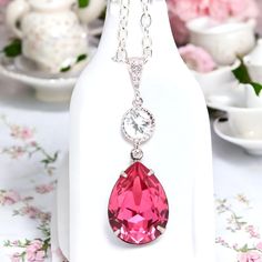 Elegant and romantic necklace made with: - gorgeous 18x13mm Rose teardrop pear shaped fancy stone, set in sterling silver plated setting - Hypoallergenic, Rhodium plated and tarnish resistant beautiful Cubic Zirconia embellished bail - sparkling .925 Sterling Silver connector with AAA Cubic Zirconia stone - the pendant drop is 1 1/2" long Finished with a sterling silver clasp and chain, the necklace is 16" and with a 2" extender chain the length can be adjusted to your choice.  MATCHING EARRINGS are available here: https://www.etsy.com/listing/224363580/pink-bridal-earring-fuchsia-earring https://www.etsy.com/listing/227859096/pink--crystal-earrings-bridal https://www.etsy.com/listing/231176642/pink-earrings-pink-bridesmaid-gift https://www.etsy.com/listing/227717919/pink-crystal-and-sterl Elegant Pink Teardrop Pendant Drop Necklace, Elegant Pink Teardrop Drop Necklace, Pear-shaped Crystal Drop Necklace Gift, Elegant Pink Drop Necklace For Gift, Elegant Teardrop Necklaces For Valentine's Day, Elegant Teardrop Necklace For Valentine's Day, Elegant Pink Pear-shaped Necklace, Pink Teardrop Pendant Drop Necklace Gift, Hot Pink Necklace