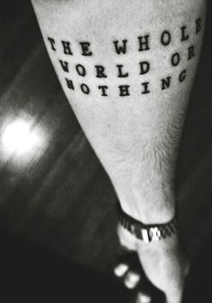 a man's foot with the words, the whole world is nothing written on it