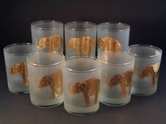 six glasses with gold painted elephants on them