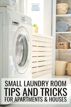 a white washer sitting on top of a floor next to a dryer and shelves