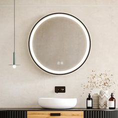 a bathroom with a round mirror above the sink