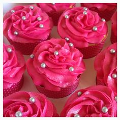 cupcakes decorated with pink frosting and pearls