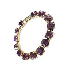 This vintage women's tennis bracelet showcases a 14+ carat purple amethyst gemstone, which has been lab-created and is perfectly round in shape. The gemstone is set in a gold tone metal with slight signs of wear, stone with minor loss,, but is still in overall good condition. Measuring 6.75 inches in length and 0.25 inches in height. Elegant Round Amethyst Crystal Bracelet, Amethyst Tennis Bracelet As A Gift, Elegant Round Purple Crystal Bracelet, Elegant Purple Round Crystal Bracelet, Classic Purple Tennis Bracelet As A Gift, Elegant Gold Amethyst Crystal Bracelet, Classic Purple Tennis Bracelet Perfect For Gifts, Classic Purple Tennis Bracelet As Gift, Purple Tennis Bracelet For Anniversary