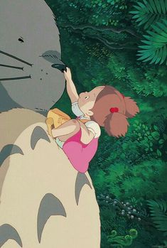 a cartoon character is kissing a cat in front of some trees and bushes, with the caption's name written on it