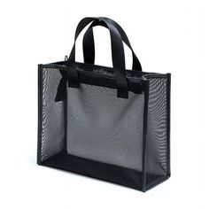 a black shopping bag with handles and straps on the front, sitting against a white background