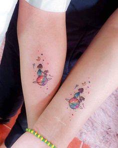 two people with matching tattoos on their legs, one is holding the other's arm