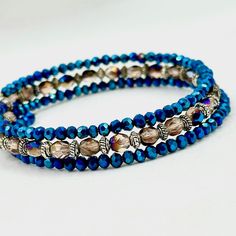 This Beaded Blue Bracelet Is Truly Dazzling, Filled With Gorgeous Two-Toned Czech Fire Polished Glass Beads, Crystals, And Silver Spacer Beads Between Them And Will Wrap Around Your Wrist 3 Times. Adjustable Blue Wrap Bracelet With Faceted Beads, Blue Beaded Crystal Bangle Bracelet, Blue Faceted Beads Bangle Jewelry, Blue Faceted Bead Bangle, Hand Wrapped Blue Beaded Bangle Bracelet, Blue Bangle With Faceted Beads, Blue Cuff Bracelet, Bracelets Diy, Bracelet Crystal