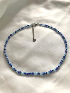 This is a beautiful necklace with a mix of blue glass beads. Built for durability and versatility, this necklace is waterproof, making it the perfect accessory for any occasion. The stainless steel extender ensures a comfortable fit, allowing you to adjust the length to your preference. Two stainless steel crimp beads accentuate the chain. The coming together of these elements results in a statement piece that not only captivates with its visual allure, but also stands the test of time with its resilient design. The order will be shipped the same day or the next day. Beads Necklace Aesthetic, Beaded Necklace Aesthetic, Necklace Fairy, Aesthetic Necklace, Princess Vibes, Necklace Aesthetic, Y2k Fairy, Crimp Beads, Jewelry Choker