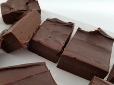 pieces of chocolate fudge cake on a white plate