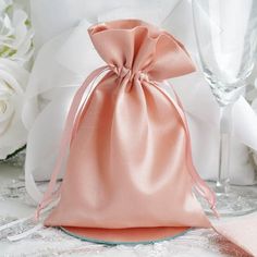 These cheerful satin favor bags are perfect for holding little goodies and favors for your guests! WHAT YOU GET: Each order is for 12 favor bags. Each favor bag measures 5" x 7". Due to location of pull strings fillable size is 5" x 6". Candy and other decorations are not included. Favors bags are perfect for favors and bring a decorative touch to any place setting or favor table at any event, party, or trade shows. Top them off with colored ribbons, flowers or beads for easy display. Available Handmade Candy, Rice Bags, Candy Jewelry, Chair Sashes, Wedding Gift Bags, Wedding Favor Bags, Satin Bags, Wedding Party Favors, Drawstring Pouch