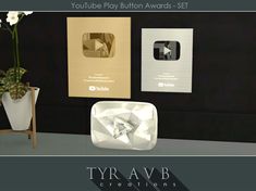 there is a vase with flowers in it next to a sign that says youtube play button awards - set