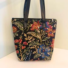 PLEASE NOTE:   This bag is NOT embroidered.  It's printed to look like embroidery. This tote handbag is a medium - large size and is gorgeous and so versatile!    BAG SIZE: ★ Top (width): 14" ★ Bottom (width): 10" ★ Height: 13"  ★ Handle drop to top of bag: 12"  CLOSURE: ★ Zipper Fabric: The exterior and interior are made with a Cotton Canvas and has foam backing as well as being interfaced. Also, there is a built-in hidden base sewn into the bottom to help keep it's structure. This makes for a Multicolor Fabric Bags With Zipper Closure, Embroidered Fabric Bags For Everyday Use, Embroidered Tapestry Bag For Everyday Use, Daily Use Tapestry Pouch Bag, Daily Use Embroidered Fabric Bag, Traditional Embroidered Tapestry Bags, Embroidered Fabric Tote Bag, Embroidered Tapestry Rectangular Shoulder Bag, Everyday Multicolor Embroidered Bag