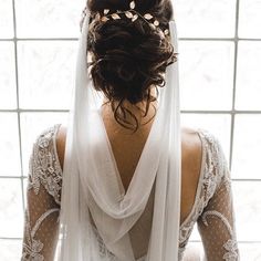 the back of a woman's head wearing a veil