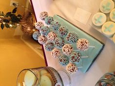 a table topped with lots of cookies and cupcakes