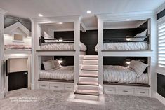 two bunk beds with stairs in the middle and another bed on the other side next to them