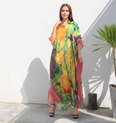 A full length kaftan plus size featured with full daisy and iris on Japanese' Kimono painting, together with decorative lines  will bring the elegant vibe of Spring and perfect for holiday occasions or any events you attend. The fabric is smoothly flowy, soft and gentle touch. FEATURES - Multi vibrant color - Flower, Floral, Daisy and Iris, Japanese Kimono Print - Personal Custom Made - Full Length Kaftan Half-Sleeves - Designer Silk Kaftan - Plus Size and Custom Length - Resort Wear, Beach Wear Floor-length Floral Print Kaftan For Eid, Eid Floral Print Floor-length Kaftan, Floor-length Floral Print Kaftan For Spring, Spring Floral Print Floor-length Kaftan, Yellow Maxi Length Kaftan For Spring, Floral Print Maxi Kaftan For Eid, Floral Print Kaftan For Eid Vacation, Yellow Maxi Length Kaftan For Beach Cover-up, Spring Vacation Floor-length Abaya