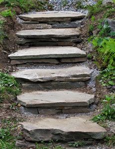 stone steps leading up to the top of a hill