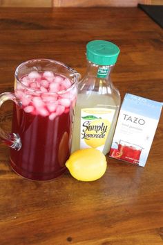 a pitcher of tea next to some lemons and other ingredients