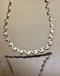 "DeKara Designs Classic Metal-14K Yellow Gold/White Gold, .583. Stones- 20 Round Diamonds G-H Color SI1-SI2 Clarity 0.90 Carats. Beautiful Modern Handmade 14K Two Tone Gold Diamond Necklace. The necklace features 44 round link made in 14K White Gold that are individually handmade and soldered in between two 14K Yellow Gold \"S\" links. There are 20 round dazzling diamonds that are professionally bezel set in 14K White Gold links. The necklace is entirely handmade with measurements of 15 inches. Elegant Gold Custom Necklace With Diamond Accents, Elegant Gold Diamond Custom Necklace, Classic Gold Hand Set Necklace, Classic Gold Necklace With Hand Set, Dazzling Gold Hallmarked Diamond Necklace, Classic Hand Set Gold Necklace, Gold Custom Necklace With 17 Jewels For Formal Occasions, Gold Diamond Custom Necklace For Formal Occasions, Formal Gold Diamond Custom Necklace