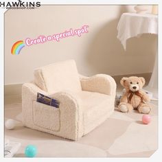 a teddy bear sitting next to a white chair