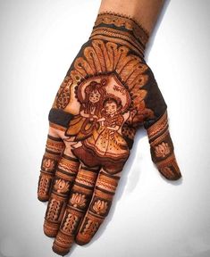 a person's hand painted with henna