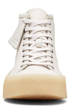 A 70s-inspired aesthetic defines a sharp street sneaker built from supple leather and set on a durable rubber cupsole. Leather upper/EVA lining and sole Imported Leather High-top Skate Shoes With Textured Sole, High-top Canvas Sneakers With Textured Sole, High-top Sneakers With Rubber Sole, Mid-top Leather Sneakers With Vulcanized Sole, White Sole High-top Sneakers With Plain Toe, Leather High-top Sneakers With Vulcanized Sole, Canvas Sneakers With Stitched White Sole, Mid-top Leather Skate Shoes With Gum Sole, Leather Mid-top Skate Shoes With Gum Sole