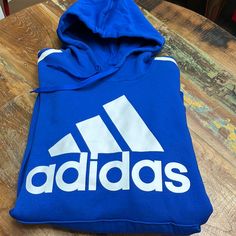 Royal Blue Adidas Hoodie With White Logo On The Front And Three White Stripes On The Sleeves. Drawstring Hood With Front Pouch Pocket. Size 2 Xl. Black Adidas Jacket, Black Jacket Hoodie, Blue Jacket Men, Hoodie Jacket Men, Adidas Pullover, Football Jackets, Adidas Zip Up, Adidas Sweater, Adidas Windbreaker