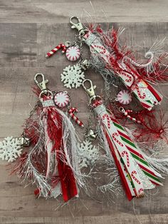 several christmas ornaments are on a wooden table