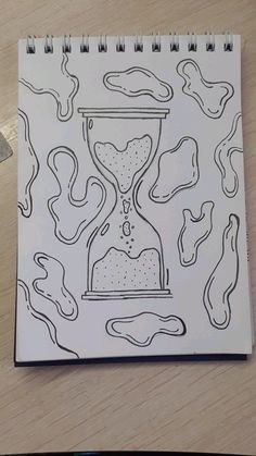 a drawing of an hourglass on top of a table