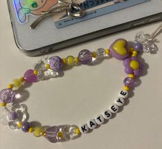 a beaded bracelet with the word kasey written on it