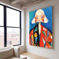 a living room with a large painting on the wall