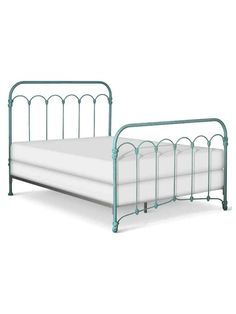 a metal bed frame with white sheets and pillows on it, against a white background