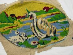 a piece of cloth with an image of swans on it