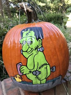 a painted pumpkin with a cartoon character on it