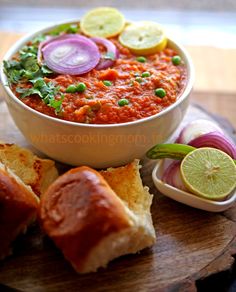 a bowl of soup with bread and vegetables