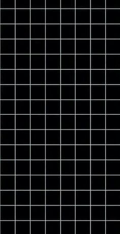 a black and white tiled wall with squares