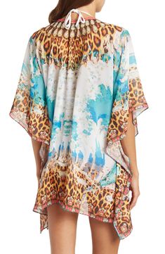 Unleash your boho spirit in this lace-up cover-up kimono styled with vivid allover patterns. 33'' length (O/S) Lace-up closure V-neck Kimono sleeves 100% polyester Dry clean Imported Model stats: 5'10", 32" bust, 25" waist, 36" hip. Model is wearing size OS. Festival Boho Print Beachwear Cover-up, Boho Print Cover-up With Kimono Sleeves For Beach Season, Bohemian Multicolor Tunic Cover-up, Bohemian Multicolor Printed Cover-up, Printed Cover-up For Beach Festival, Bohemian Cover-up With Boho Print For Vacation, Boho Print Tunic Cover-up For Festival, Printed Beach Season Festival Cover-up, Printed Festival Cover-up For Beach Season