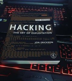 a book sitting on top of a computer keyboard