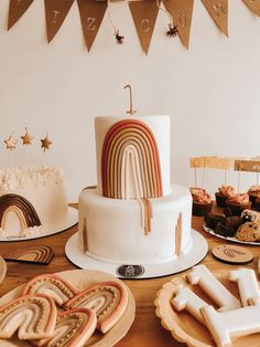 a table topped with lots of cakes and cookies