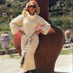 The knitted Dress, Made in a Boucle yarn, is unusual in that it is a Midi length with awesome long sleeves with a slight flare to the rolled cuffs (nice for air flow)  - The oversized Cowl Neck creates a dramatic contrast as the Fitted -Style shapes the body to allow for the bulk in the yarn.  Complete with a rope tie belt or a synch[ of your choice!  A straightforward pattern shape-wise, knitted on 7mm, this is the quickest and most flattering full-length dress around! Hand-knitted Long Sleeve Dress For Fall, Hand Knitted Long Sleeve Dress For Fall, Long Fitted Cream Sweater, Mohair Sweaters, Knitted Cowl, Boucle Yarn, Rope Belt, Cowl Neck Dress, Full Length Dress