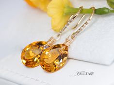 The Sunshine Earrings - Solid Gold 14K Diamond Pear Madeira Citrine Earrings, Genuine Natural Citrine Earrings These earrings are composed of the most amazing genuine, natural Madeira Citrines. The Citrines have the most fantastic warm, golden color. These red-carpet worthy gemstones are absolutely clean and have an intense golden color. They hang from Solid Gold 14k gold unique earwires that are set with 5 diamonds each. ⭐ DETAILS: ✔️ Length including earwires: 1.4″ (about 3.5 cm) ✔️ Gold: All the components are 14K SOLID GOLD (stamped on the earwires) ✔️ Certificate: The Earrings arrive with a Gemstone Authenticity Certificate ✔️ The earwires in the photo are genuine Diamond Earwires: each earring is set with five .5-pt diamonds (I1-I2 grade/H,I color; 2.5 pts. TW) (you can choose to cha Fine Jewelry Citrine Earrings For Wedding, Citrine Fine Jewelry Earrings For Wedding, Citrine Drop Earrings For Wedding, Citrine Wedding Earrings Fine Jewelry, Elegant Citrine Earrings For Wedding, Wedding Fine Jewelry Citrine Earrings, Sunshine Earrings, Drop Earrings Diamond, Citrine Drop Earrings