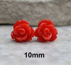 These are approximately 10mm Resin Roses in a Red color. US deliveries are a low flat shipping rate for the entire order. Resin Cabochons Posts...solid hypo-allergenic surgical steel. Backs...comfort grip hypo-allergenic rubber. Earrings come to you carded and in my cotton filled gold embossed gift boxes. SEE THE REST OF OUR SWAROVSKI EARRING COLLECTION AT: http://www.etsy.com/shop/rostone Rubber Earrings, Red Rose Earrings, Rose Earring, Acrylic Rose, Resin Rose, Earrings Acrylic, Beautiful Red Roses, Earring Collection, Square Stud