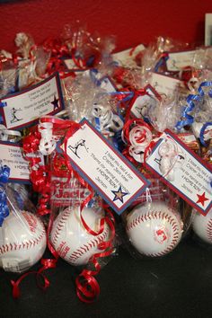 many baseballs are wrapped in red, white and blue ribbons