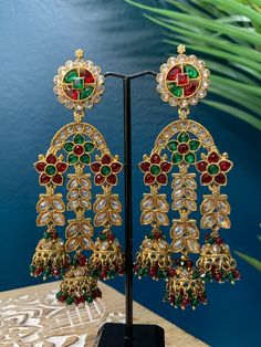 Medium polki jhumki , about 4.5 inch long and one and half wide. Light weight and unique. Come in antique base and champagne polki stone. Luxury Bollywood Chandbalis For Festive Occasions, Champagne, Stone