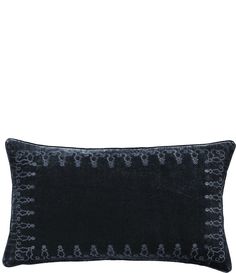 a black velvet pillow with embroidered teddy bears on it