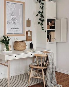 a white desk and chair in a room