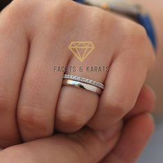 a woman's hand with a diamond ring on top of her finger and the words facets & karts written in gold